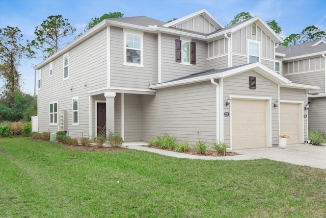 view of front facade featuring a garage and a front yard