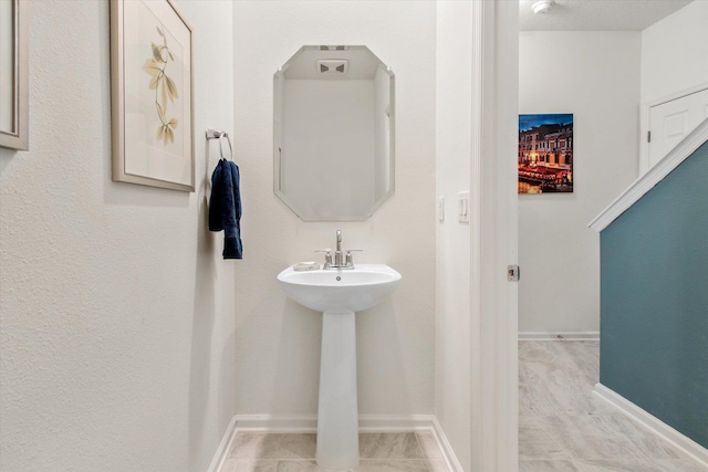 bathroom with tile patterned floors