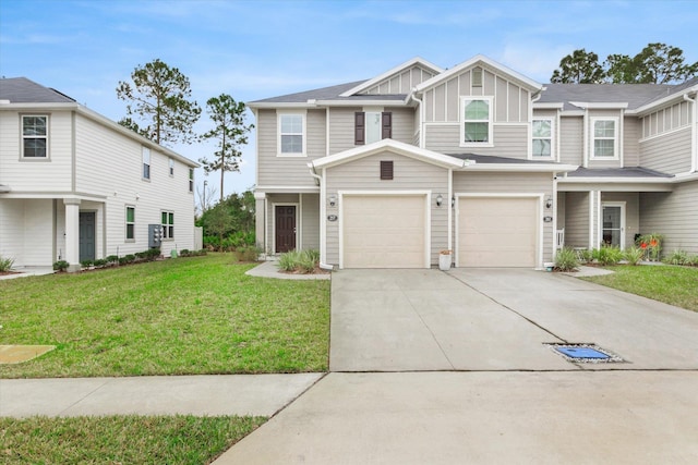 view of front of property with a garage and a front yard