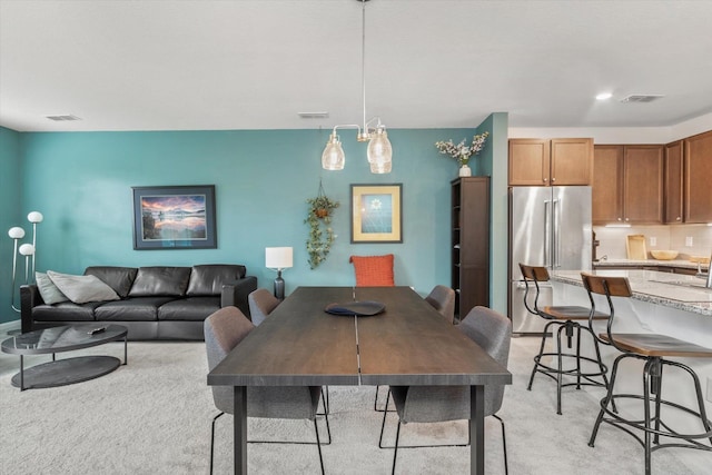 view of carpeted dining space