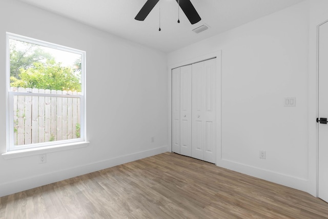 461 S Woodlawn St, Saint Augustine, FL 32084 - unfurnished bedroom featuring wood finished floors, a closet, and a ceiling fan