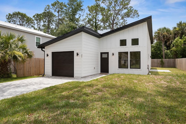461 S Woodlawn St, Saint Augustine, FL 32084 - modern inspired farmhouse featuring board and batten siding, an attached garage, and driveway