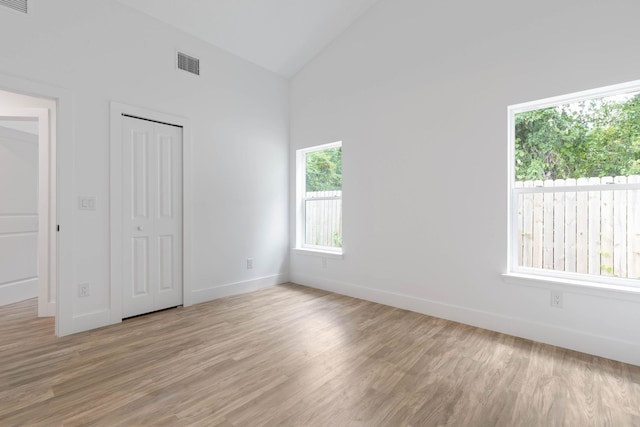 461 S Woodlawn St, Saint Augustine, FL 32084 - unfurnished bedroom featuring light wood-type flooring, a closet, and high vaulted ceiling