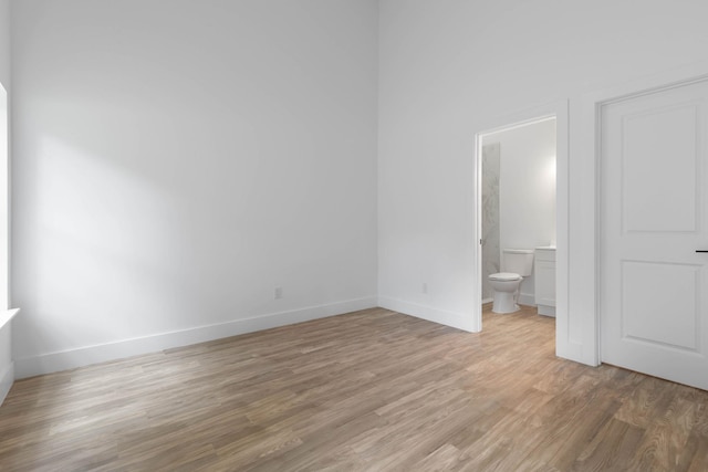 461 S Woodlawn St, Saint Augustine, FL 32084 - unfurnished bedroom with light wood-type flooring and ensuite bathroom