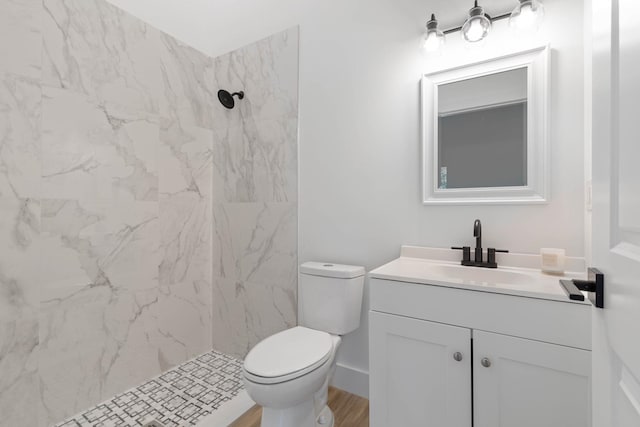 461 S Woodlawn St, Saint Augustine, FL 32084 - full bathroom featuring vanity, a marble finish shower, and wood finished floors