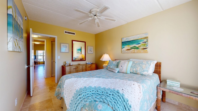 bedroom featuring visible vents and ceiling fan