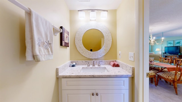 ensuite bathroom featuring vanity and ensuite bathroom