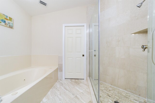 bathroom with shower with separate bathtub