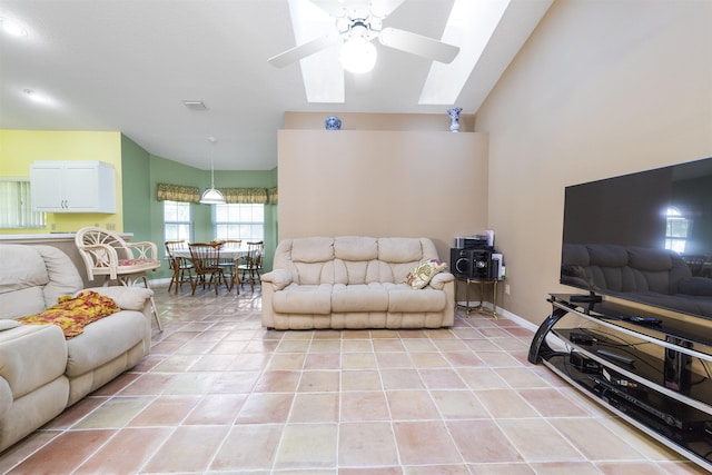 tiled living room with ceiling fan