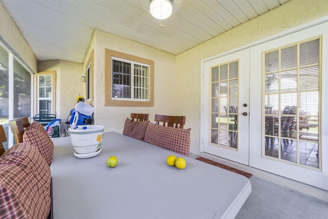 sunroom / solarium featuring french doors