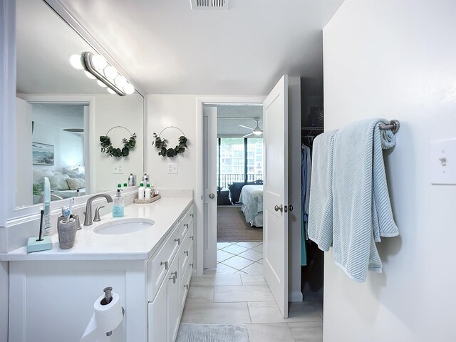 bathroom featuring vanity and ceiling fan