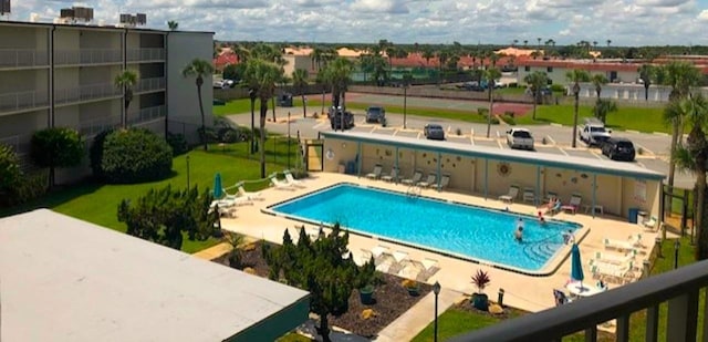 view of swimming pool with a patio area