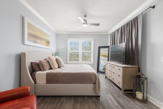 bedroom with a textured ceiling, ornamental molding, and wood finished floors