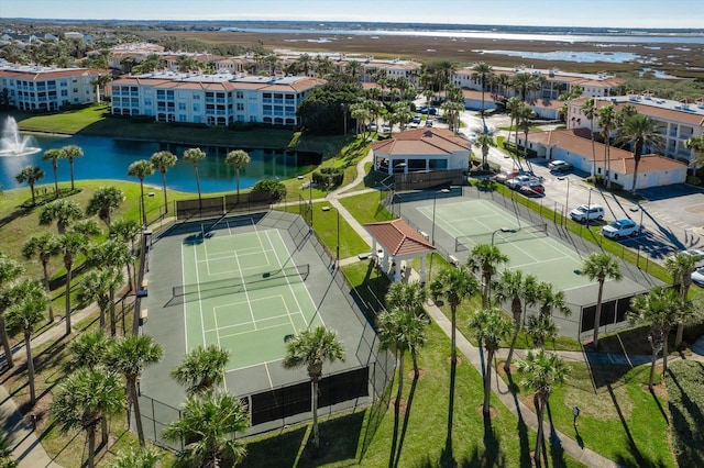 birds eye view of property with a water view