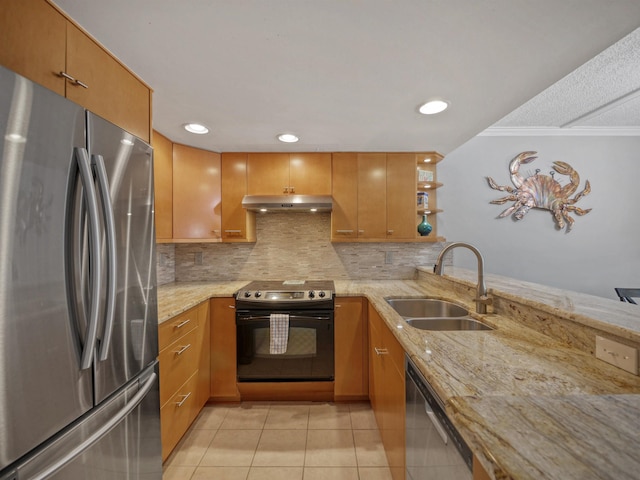 kitchen with sink, light tile patterned floors, appliances with stainless steel finishes, light stone counters, and kitchen peninsula