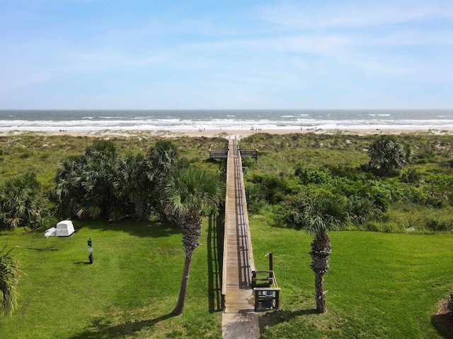 exterior space with a water view and a view of the beach