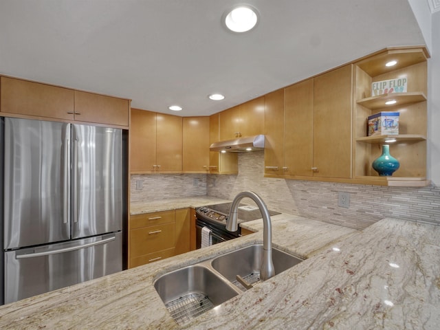 kitchen with backsplash, kitchen peninsula, light stone countertops, and appliances with stainless steel finishes