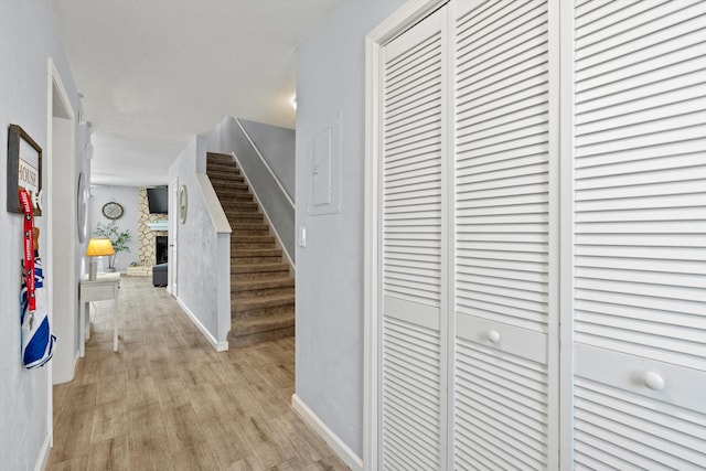 hall with light hardwood / wood-style floors