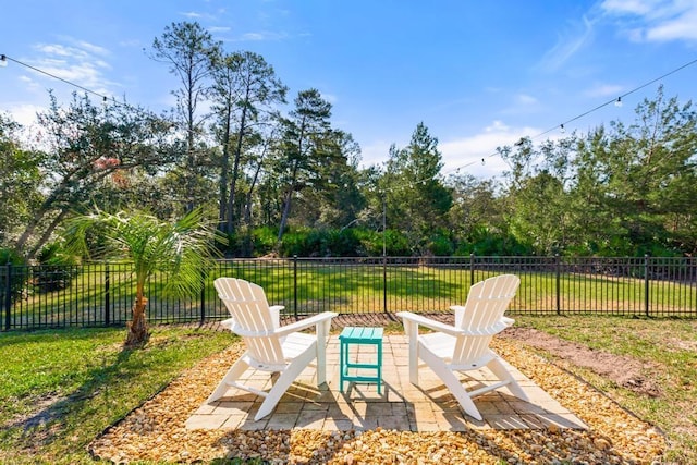 view of yard featuring fence and a patio