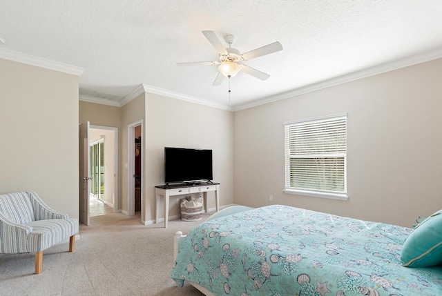 carpeted bedroom featuring ceiling fan, a textured ceiling, baseboards, and crown molding