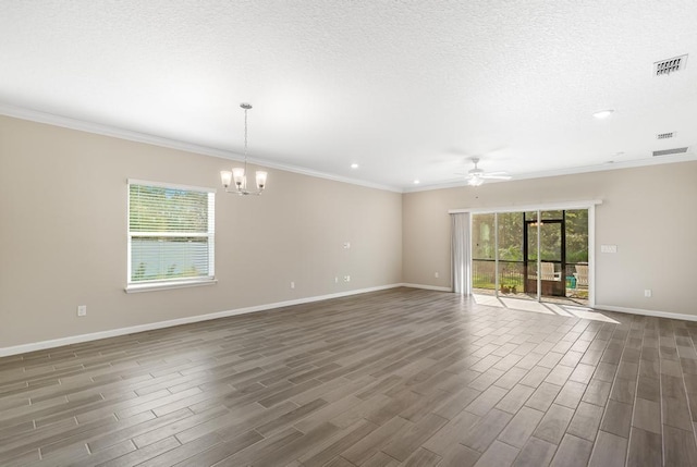 spare room featuring baseboards, plenty of natural light, visible vents, and dark wood-type flooring