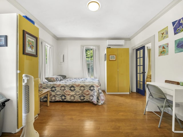 8 Davis St, Saint Augustine, FL 32084 - bedroom featuring ornamental molding, an AC wall unit, and wood finished floors