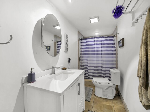 8 Davis St, Saint Augustine, FL 32084 - bathroom featuring vanity, toilet, baseboards, tile patterned floors, and a shower with shower curtain