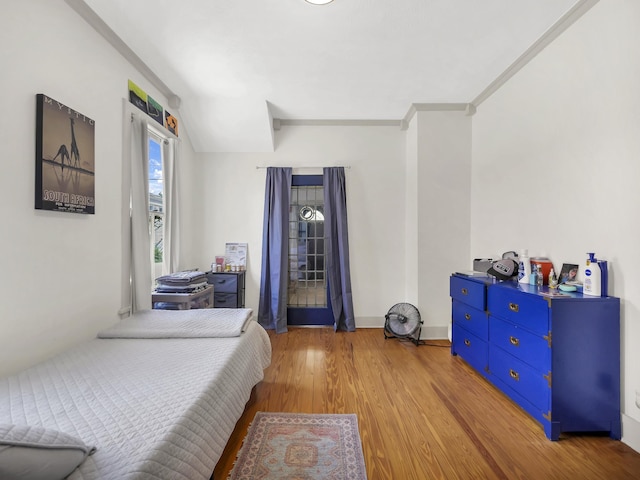 8 Davis St, Saint Augustine, FL 32084 - bedroom featuring wood finished floors and ornamental molding