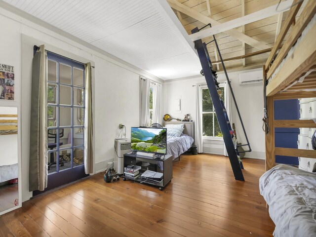 8 Davis St, Saint Augustine, FL 32084 - bedroom with a wall unit AC, wood-type flooring, and wood ceiling