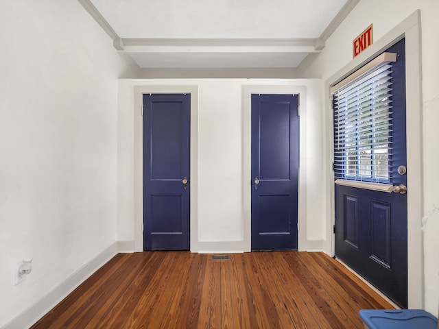 8 Davis St, Saint Augustine, FL 32084 - entrance foyer featuring dark wood-style floors, beam ceiling, and baseboards