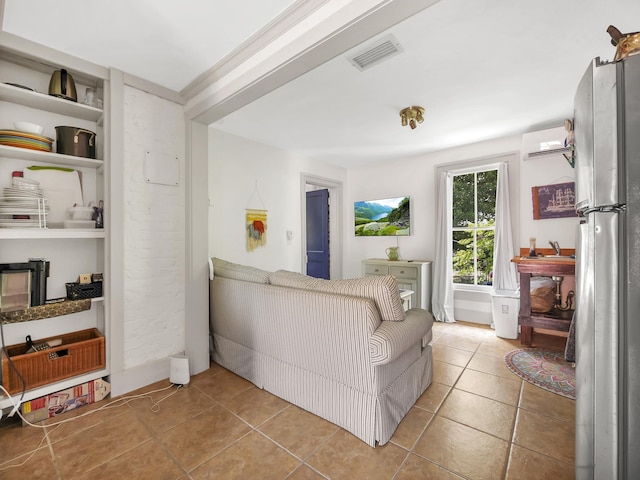 8 Davis St, Saint Augustine, FL 32084 - tiled living area featuring an AC wall unit