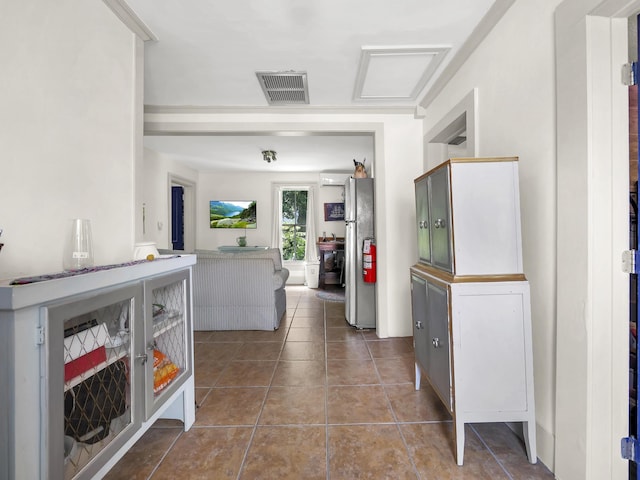 8 Davis St, Saint Augustine, FL 32084 - corridor with tile patterned flooring and attic access