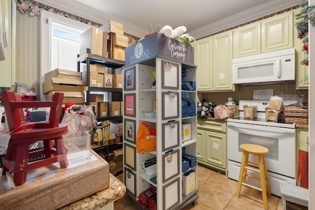 kitchen with crown molding, light tile patterned floors, and white appliances