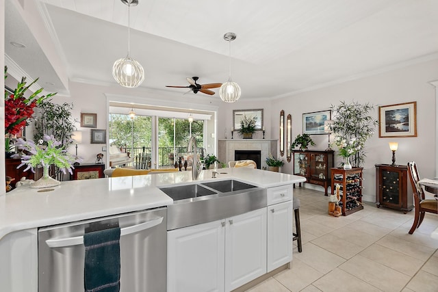 kitchen with sink, stainless steel dishwasher, ceiling fan, light tile patterned floors, and white cabinetry