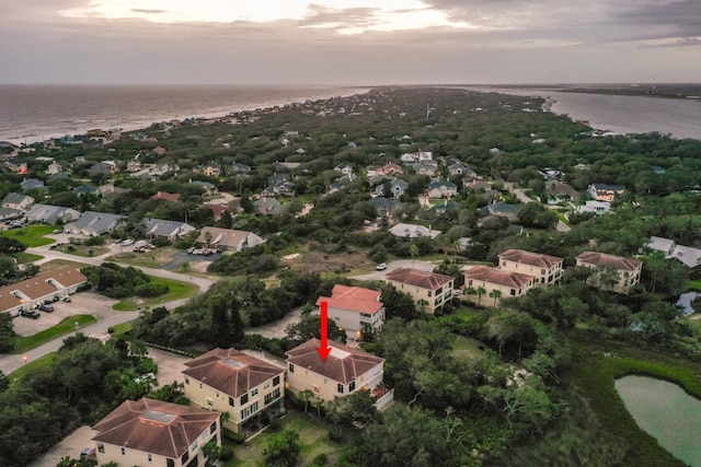 aerial view at dusk with a water view