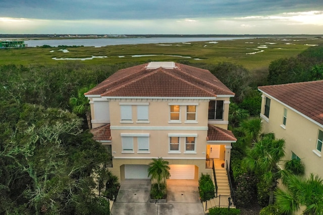 birds eye view of property featuring a water view