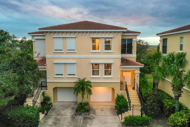 mediterranean / spanish-style house featuring a garage