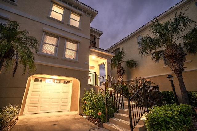 mediterranean / spanish-style home with a garage