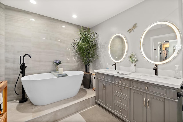 1602 Windjammer Ln, Saint Augustine, FL 32084 - full bathroom with double vanity, a soaking tub, and recessed lighting