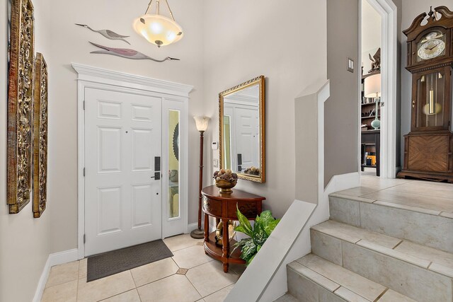 entrance foyer with light tile patterned floors