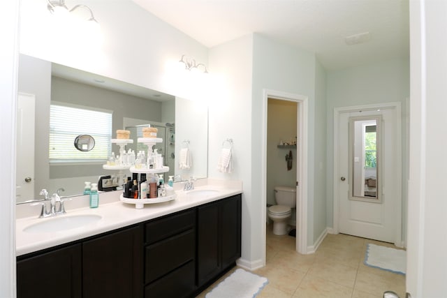 326 Gianna Way, Saint Augustine, FL 32086 - bathroom featuring double vanity, tile patterned floors, and a shower