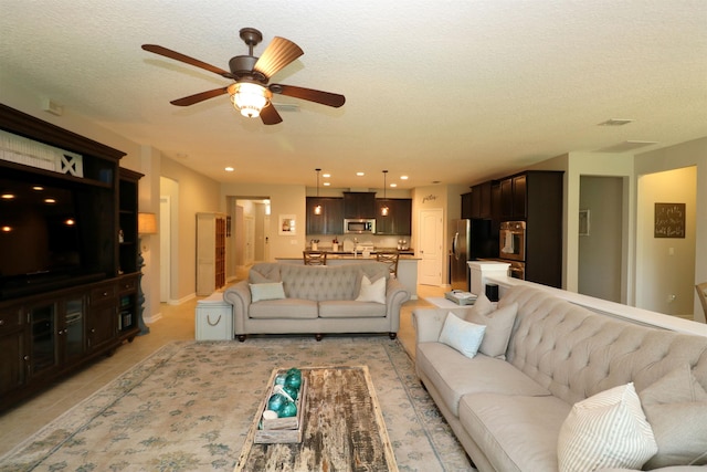 326 Gianna Way, Saint Augustine, FL 32086 - living room featuring ceiling fan, light tile patterned flooring, a textured ceiling, and recessed lighting