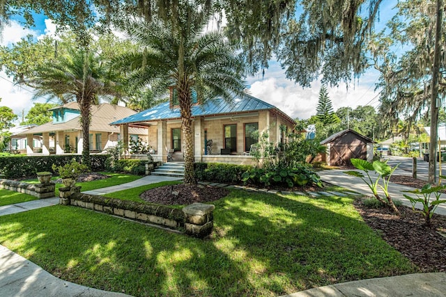 view of front of house with covered porch and a front yard