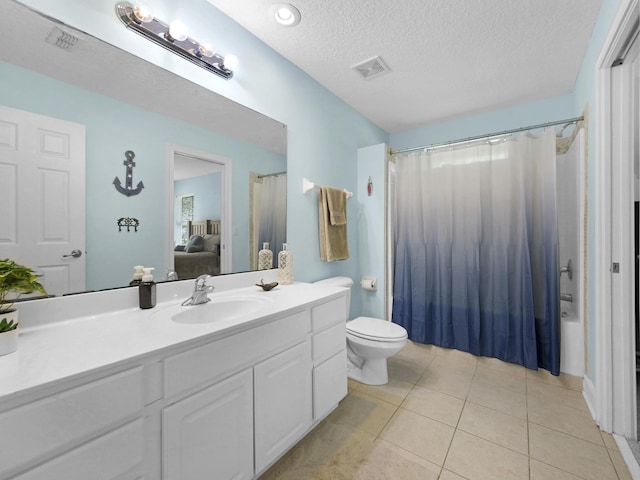304 1st St, Saint Augustine, FL 32084 - ensuite bathroom featuring vanity, tile patterned flooring, shower / bath combination with curtain, and a textured ceiling