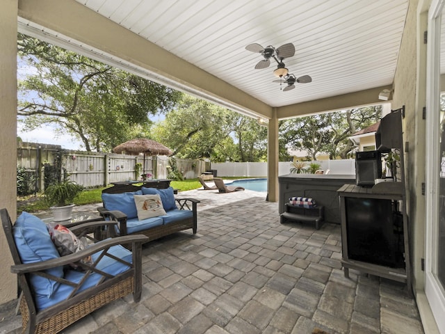 304 1st St, Saint Augustine, FL 32084 - fenced backyard with a patio area, a ceiling fan, and an outdoor living space