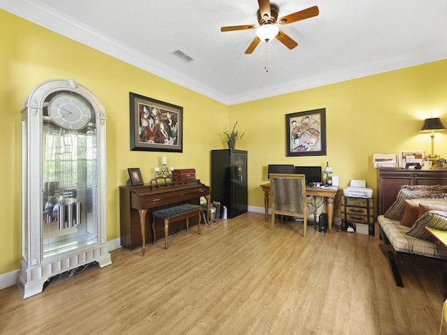 304 1st St, Saint Augustine, FL 32084 - sitting room with ornamental molding, light wood-type flooring, ceiling fan, and a desk