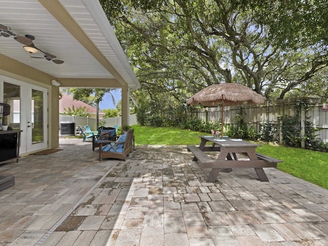 304 1st St, Saint Augustine, FL 32084 - fenced backyard featuring outdoor dining space, a patio, ceiling fan, and french doors
