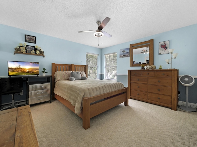 304 1st St, Saint Augustine, FL 32084 - bedroom featuring light carpet, a textured ceiling, and a ceiling fan