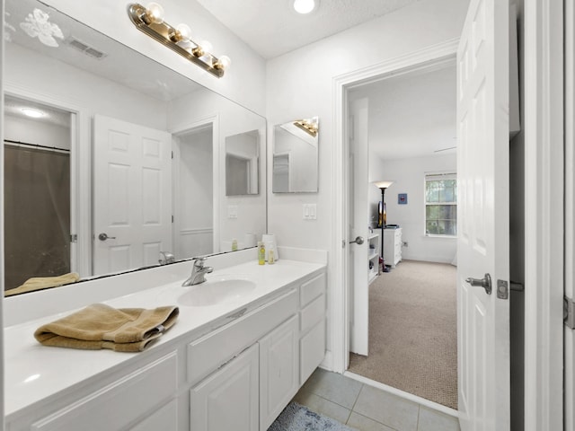 304 1st St, Saint Augustine, FL 32084 - bathroom with vanity and tile patterned floors