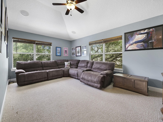 304 1st St, Saint Augustine, FL 32084 - carpeted living area with a ceiling fan and lofted ceiling